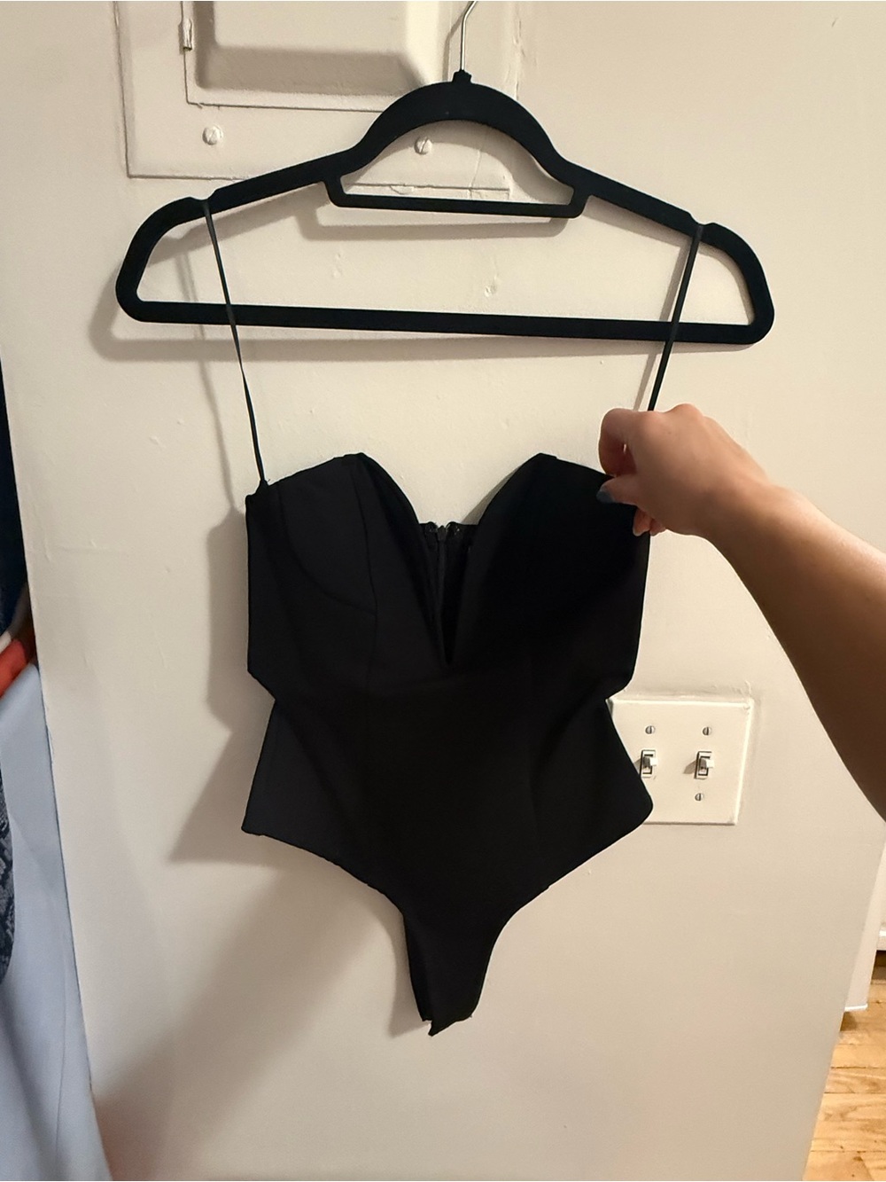 superdown Black Strapless One-Piece Bodysuit. deep v front